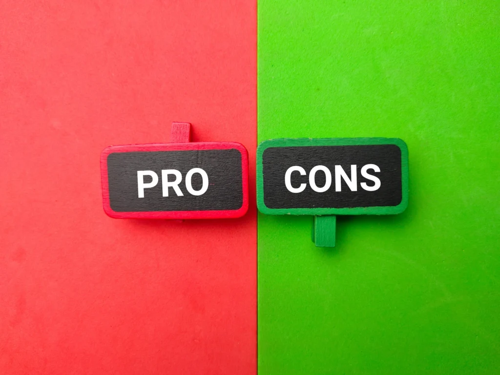 Pros and cons written on a red and green colored background.
